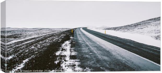 Road trip secondary with snow without anyone driving through Iceland Canvas Print by Joaquin Corbalan