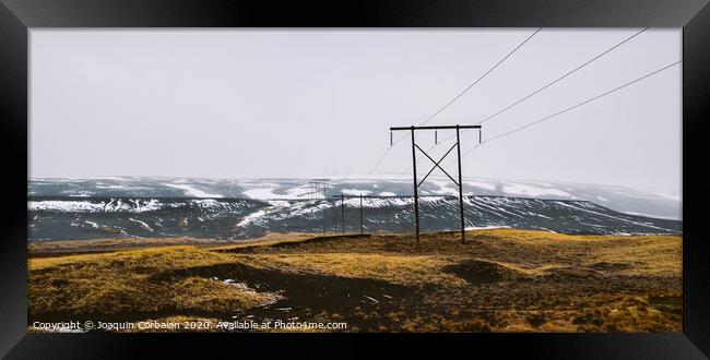 Icelandic landscapes full of green grass, sea and blue sky. Framed Print by Joaquin Corbalan