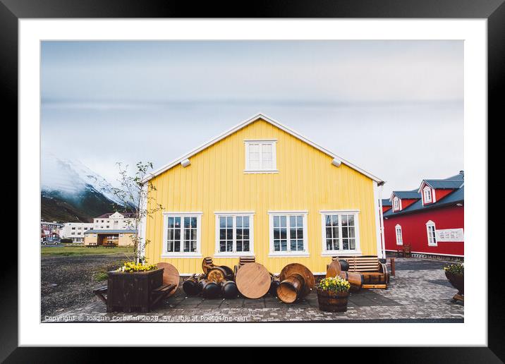 Icelandic landscapes full of green grass, sea and blue sky. Framed Mounted Print by Joaquin Corbalan