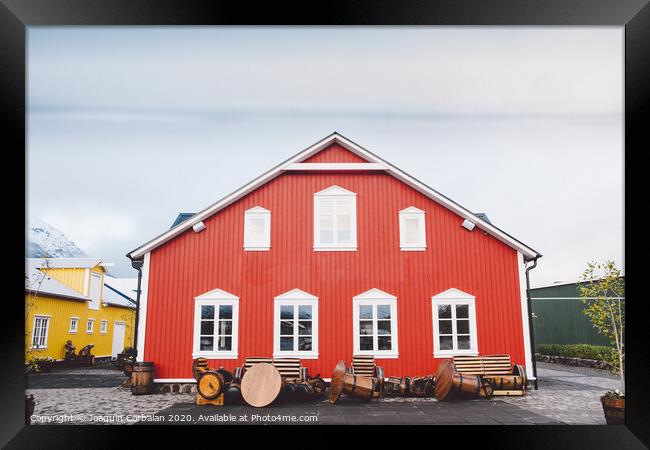 Nice house with red wooden planks in iceland. Framed Print by Joaquin Corbalan