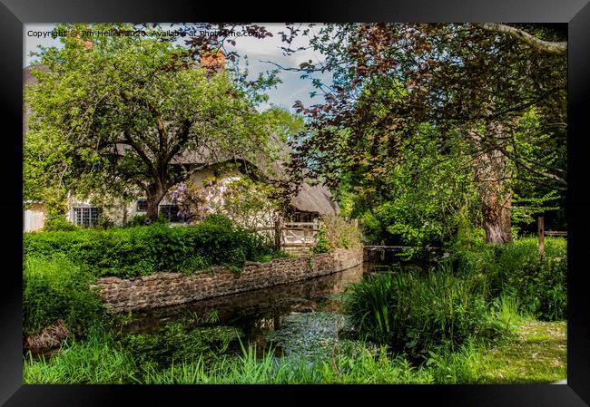 Thatched cottage by the river Lambourn  Framed Print by Jim Hellier