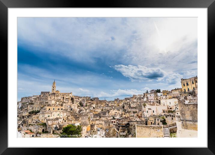 Long panoramic views of the rocky old town of Matera with its stone roofs. Framed Mounted Print by Joaquin Corbalan
