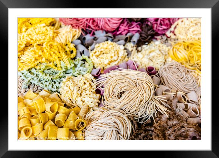 Many types of uncooked Italian pasta of various colors and shapes Framed Mounted Print by Joaquin Corbalan