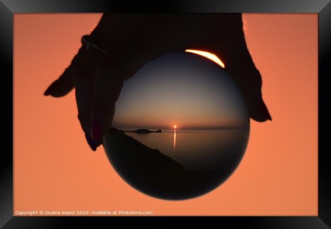 Sunset globe Framed Print by Duane evans
