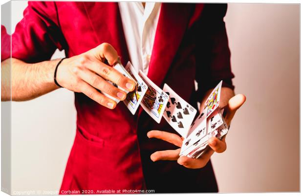 Hands of magician doing tricks with a deck of cards. Canvas Print by Joaquin Corbalan