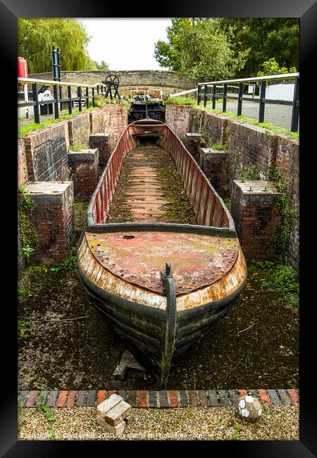 Abandoned shell of narrowboat at Stoke Brurne in N Framed Print by Clive Wells