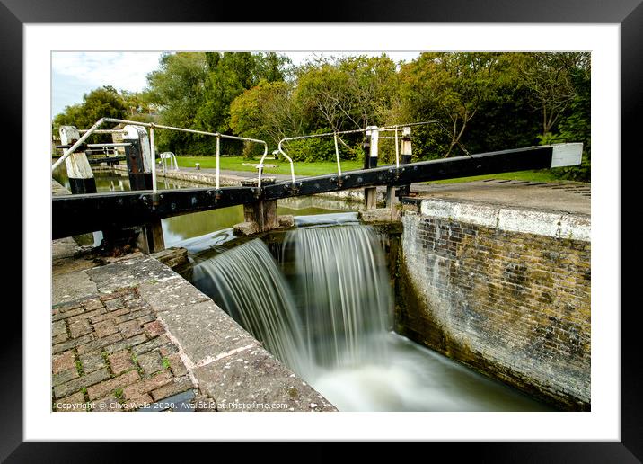 Overflowing lock gates at Stoke Brurne. Framed Mounted Print by Clive Wells