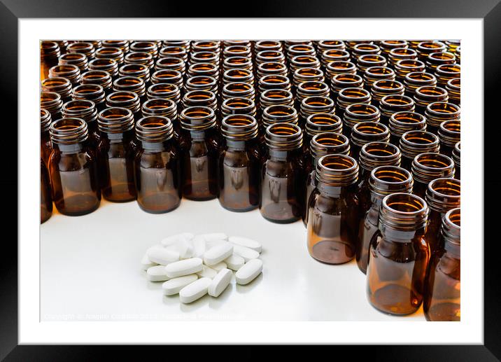 Heap of pills with empty medicine containers, pharmaceutical industry concept. Framed Mounted Print by Joaquin Corbalan