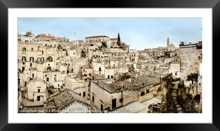 Panoramic view of Matera (Sassi di Matera) with its steep ancient stone streets, European Capital of Culture 2019, with clouds, at southern Italy, waiting to welcome tourists. Framed Mounted Print by Joaquin Corbalan
