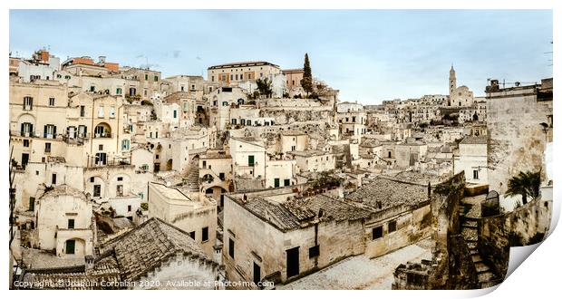 Panoramic view of Matera (Sassi di Matera) with its steep ancient stone streets, European Capital of Culture 2019, with clouds, at southern Italy, waiting to welcome tourists. Print by Joaquin Corbalan