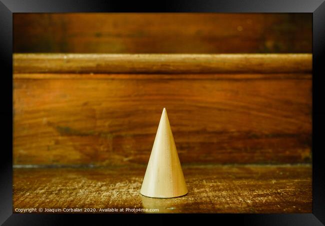 Cone shapes of solid wood to study geometry Framed Print by Joaquin Corbalan