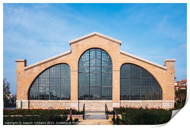 Valencia, Spain - December 30, 2019: Facade of the old train workshop factories in the Central Park of Valencia. Print by Joaquin Corbalan
