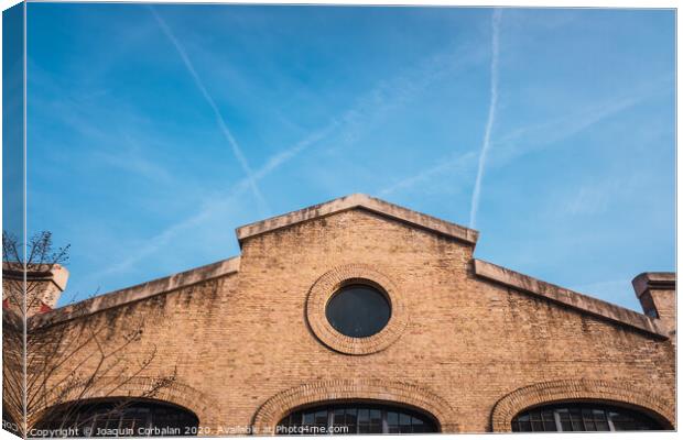 Facade of the old train workshop factories in the Central Park of Valencia. Canvas Print by Joaquin Corbalan