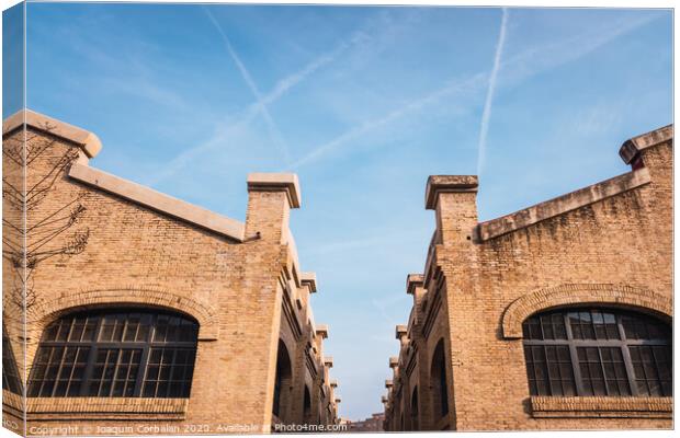 Old brick industrial buildings renovated for social uses of the city in Valencia, Spain. Canvas Print by Joaquin Corbalan