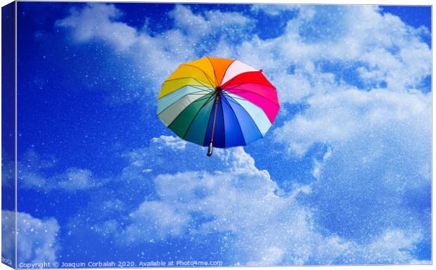 Multicolored umbrella flying suspended over bright blue sky background , with copy space. Canvas Print by Joaquin Corbalan