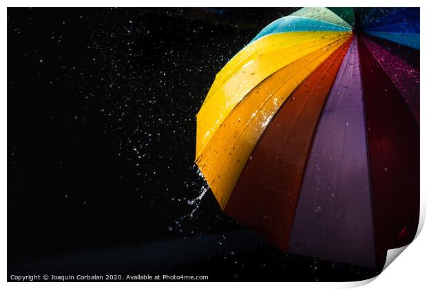 Rain on a warm-toned umbrella lit by the sun, isolated on black background with copy space. Print by Joaquin Corbalan