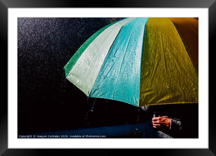 Detail of an umbrella with raindrops after a rainy day. Framed Mounted Print by Joaquin Corbalan