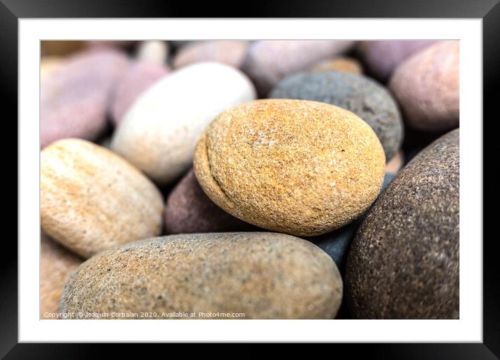 Natural background composed of pebbles and small rocks. Framed Mounted Print by Joaquin Corbalan