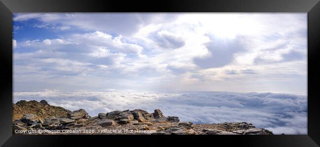 A day above the clouds at the top of the Peñarala mountain in Madrid, a mountaineering and adventure excursion. Framed Print by Joaquin Corbalan