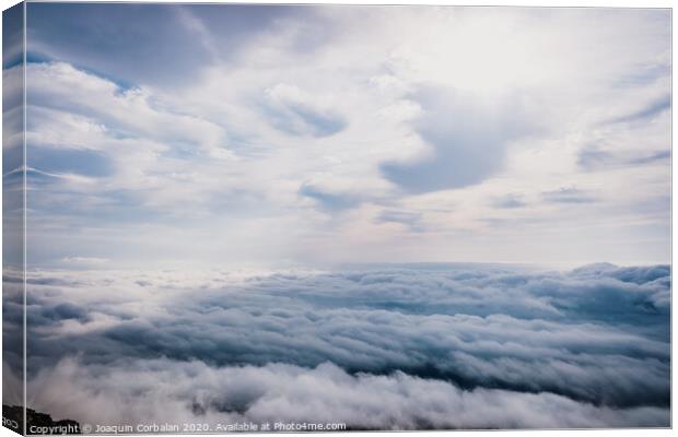 Awesome view on top of the clouds on a cloudy morning. Canvas Print by Joaquin Corbalan