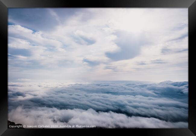 Awesome view on top of the clouds on a cloudy morning. Framed Print by Joaquin Corbalan