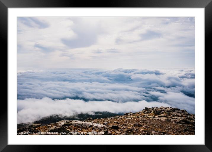 Mounds of rocks on the way to the ascent to the top of the mountain. Framed Mounted Print by Joaquin Corbalan