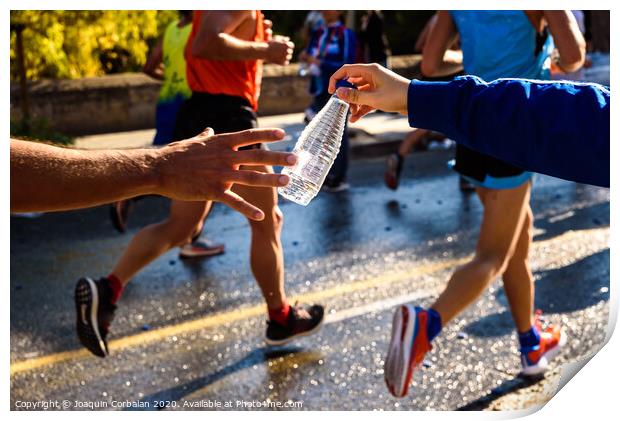 Runner collects a bottle of water to hydrate during a workout. Print by Joaquin Corbalan