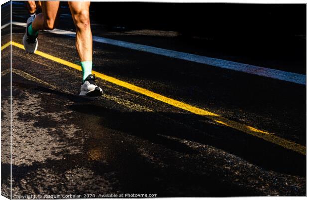 Running athletes have powerful quadriceps and calf muscles for running on asphalt. Canvas Print by Joaquin Corbalan