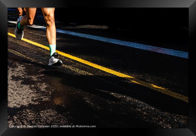Running athletes have powerful quadriceps and calf muscles for running on asphalt. Framed Print by Joaquin Corbalan