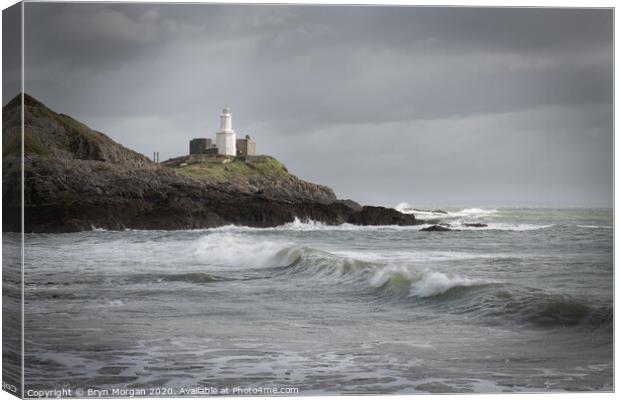 Wave at Mumbles lighthouse Canvas Print by Bryn Morgan