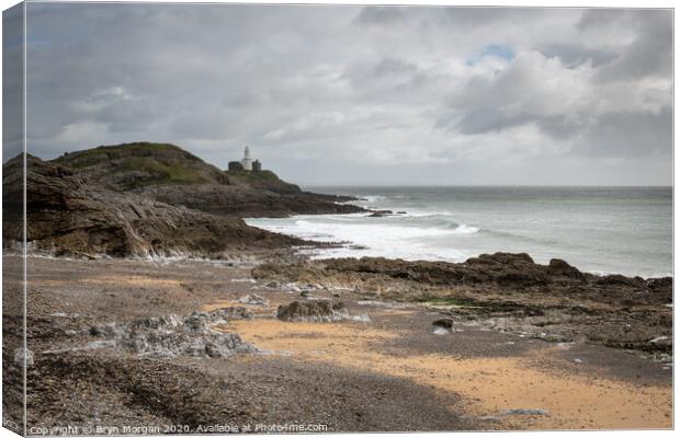 Mumbles lighthouse from Bracelet bay Canvas Print by Bryn Morgan