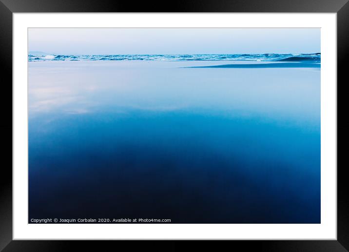 Silky calm water background with waves in the background and calm sea. Framed Mounted Print by Joaquin Corbalan