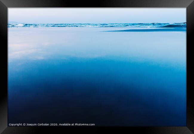 Silky calm water background with waves in the background and calm sea. Framed Print by Joaquin Corbalan