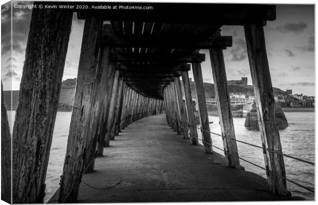 Under the East pier Canvas Print by Kevin Winter