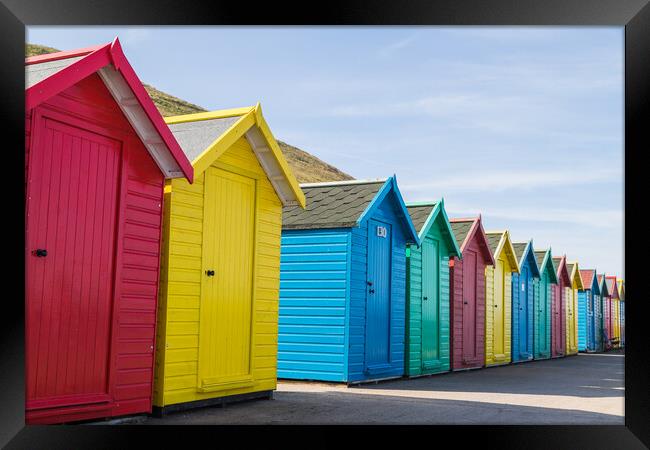 Pretty beach huts in Whitby Framed Print by Jason Wells