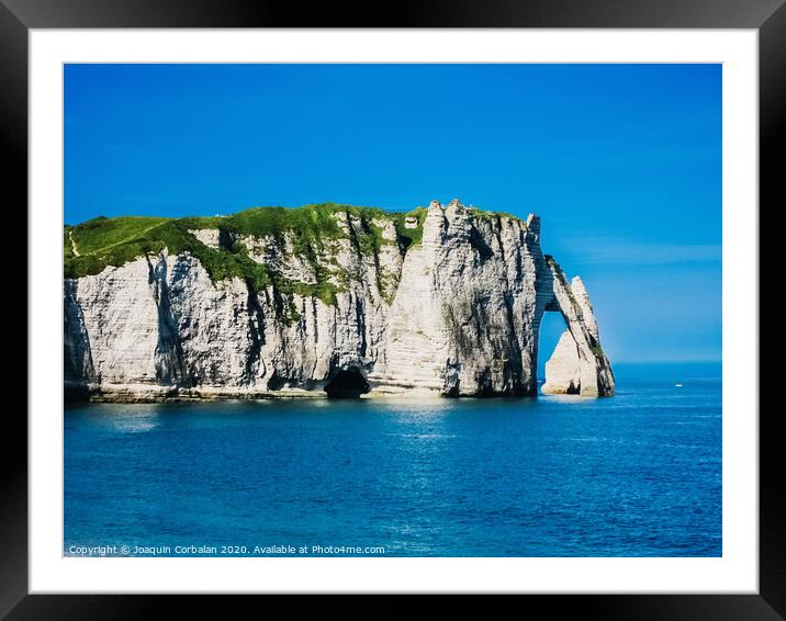 Natural rock arches and cliffs on the coast Sorrento and Capri, Italian islands with crystal clear waters where tourist boats crowd to photograph them in summer. Framed Mounted Print by Joaquin Corbalan