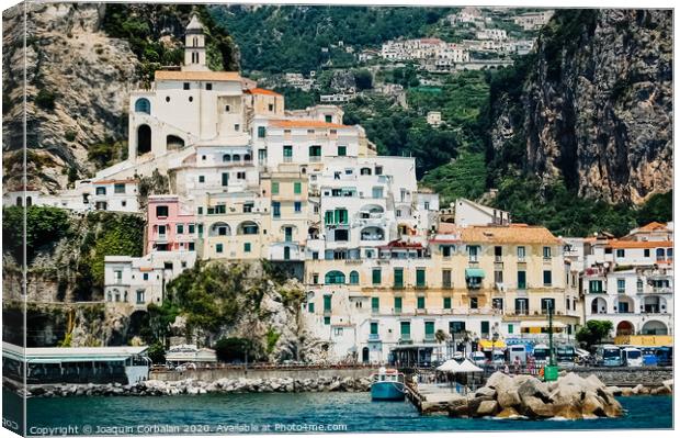 Sorrento, Italy - June 5, 2019: View from the sea of this picturesque Italian Mediterranean city, with old and colorful houses built on the side of a hill. Canvas Print by Joaquin Corbalan