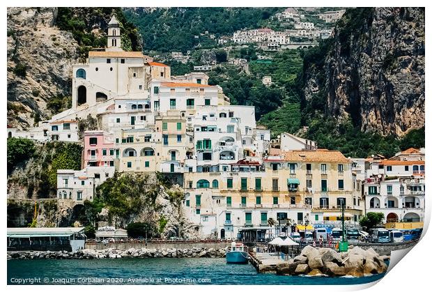 Sorrento, Italy - June 5, 2019: View from the sea of this picturesque Italian Mediterranean city, with old and colorful houses built on the side of a hill. Print by Joaquin Corbalan
