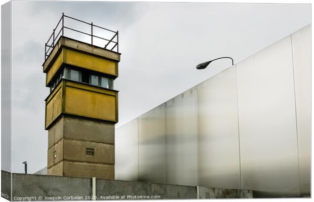 Berlin, Germany - June 6, 2019: Watchtower next to a wall on a border to control illegal immigrants. Canvas Print by Joaquin Corbalan