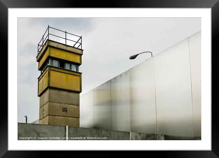 Berlin, Germany - June 6, 2019: Watchtower next to a wall on a border to control illegal immigrants. Framed Mounted Print by Joaquin Corbalan