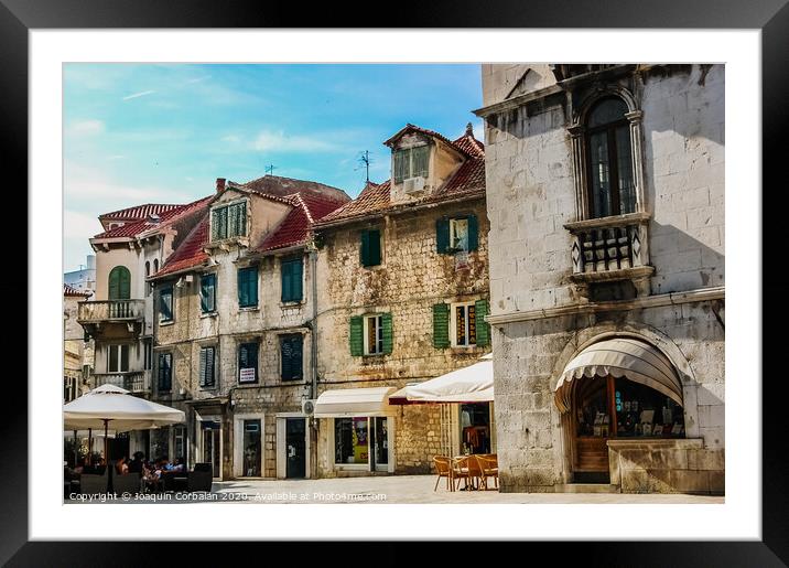 Old town of Split, medieval city with streets full of tourists and religious buildings. Framed Mounted Print by Joaquin Corbalan