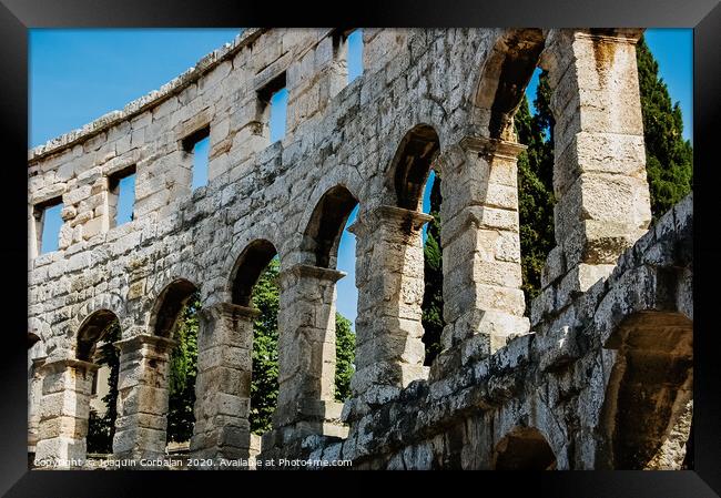 Roman amphitheater in Pula, the best preserved ancient monument in Croatia, visited by hundreds of tourists. Framed Print by Joaquin Corbalan