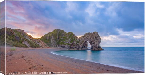 Majestic Natural Arch by the Calm Seaside Canvas Print by Ian Stone