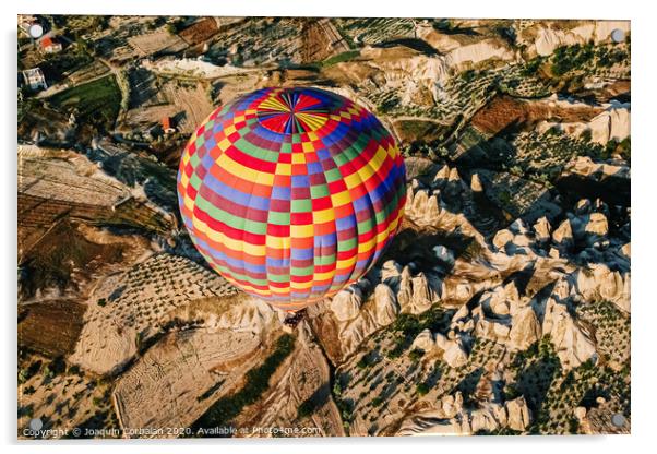 Travelers and tourists flying over mountains at sunset in a colorful aerostat balloon in Goreme, the Turkish cappadocia. Acrylic by Joaquin Corbalan