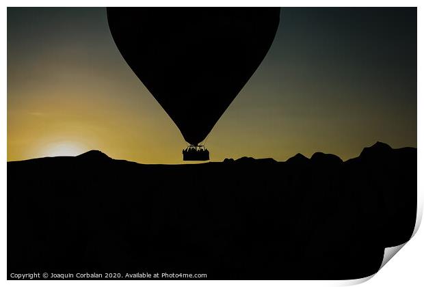 Silhouette of travelers and tourists flying over mountains at sunset in an aerostatic balloon. Print by Joaquin Corbalan