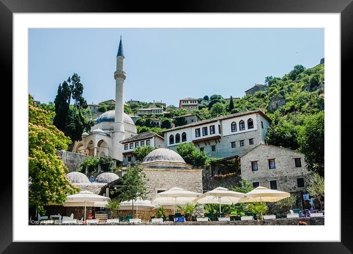 View of the main mosque of the city, in the sun next to a bar where you can have a drink. Framed Mounted Print by Joaquin Corbalan