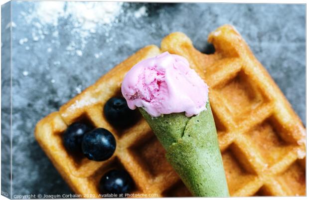 The pleasure of having breakfast on a Sunday morning a luxurious waffle with antioxidant red fruits full of vitamins for a healthy and full life. Canvas Print by Joaquin Corbalan