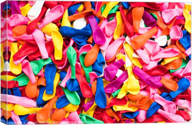 Close-up of many colorful children's balloons, background for motifs of colorful children's parties. Canvas Print by Joaquin Corbalan