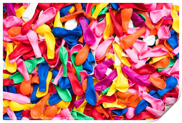 Close-up of many colorful children's balloons, background for motifs of colorful children's parties. Print by Joaquin Corbalan