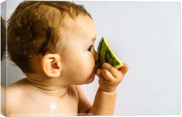 Baby in profile eating a watermelon drooling and getting dirty with the sticky juice of the fruit. Canvas Print by Joaquin Corbalan